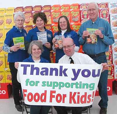 Robert Hruska, grocery manager at Fareway, seated at right, invites Fareway shoppers to donate to the 15th annual Food for Kidz effort at Fareway through Saturday, Feb. 10. Kiwanis Club Food for Kidz helpers include Mary Brouillard, seated at left, and, standing from left, Diane Bergland, Carol Youdas, Barb Howes and Lincoln Harker.