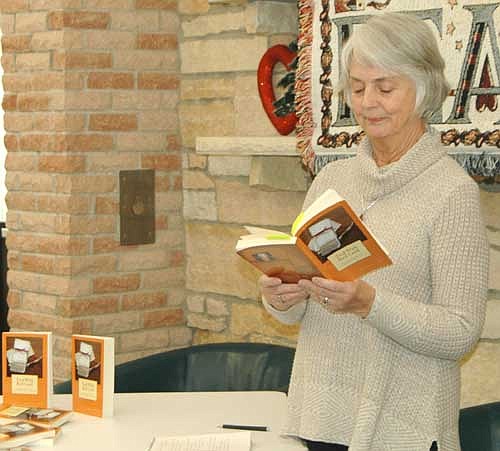 Peggy Lenton Hale reads from her book, Tied with Red Cord...Unraveling My Grandmother's Story, at the Stewartville Public Library on Saturday afternoon, Feb. 3. Lenton told the audience she has fond memories of growing up in Stewartville.