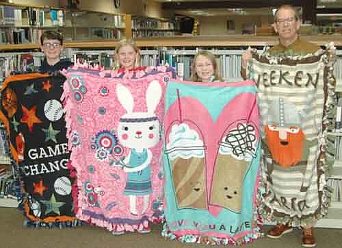 The Stewartville Middle School Builders Club recently made 30 blankets for the children at the Ronald McDonald House in Rochester. Members include, from left, Christian Garza and Sophia Kruger, seventh graders; Madison Feine, a sixth grader; and Craig Bell, Builders Club advisor