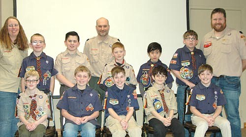 Arrow of Light scouts crossed the bridge to become Boy Scouts during a ceremony at the Stewartville American Legion Post 164 on Sunday, Feb. 18. The new Boy Scouts and their leaders include, front row, from left, Quade Knoll, Mason Holtan, William Kundert, Sebastian Mielke and Leslie Kundert. Back row, from left, Alison Eden, scout leader; Jacob Eden, Max Bredesen, Brian Knoll, scout leader; Zachary Ringen, Liam Nguyen, William Kitzmann and Matt Kitzmann, scout leader. Marcus Johnson, another Arrow of Light scout who crossed over to Boy Scouts, is not pictured.