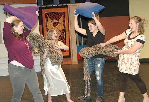 A pillow fight erupts during a dress rehearsal for Stewartville Community Theatre's Dracula, the Rock Musical!  Actresses, from left, include  Elizabeth (Melissa Kloempken), Lucy (Darien Hilmerson), Jane (Emma Hansen) and Mina (Katie Eberhard). The play will be presented at the Stewartville High School Performing Arts Center this Friday, March 2 and Saturday, March 3 at 7:30 p.m. each evening, and this Sunday, March 4 at 2 p.m. Aaron Rocklyn, the show's director, says audiences will enjoy the play's fast pace and humorous music. "There's quite a bit of music and comedy," he said.