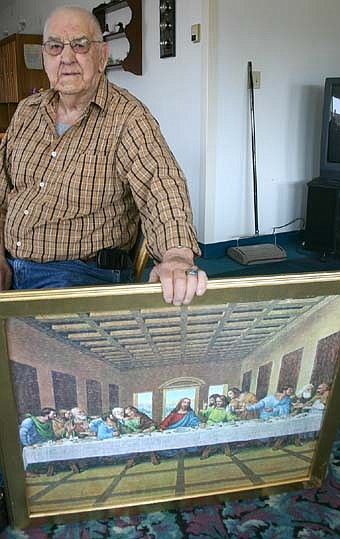 Ernie Fossum, a resident of the Stewartvilla Apartments, spent about a week putting together a 1,000-piece puzzle depicting Jesus with his disciples at the Last Supper. Helen Volkman helped him with the work. "I put a lot of them together," Fossum said. "I've done 10 or 12 since Christmas. It's relaxing and it's something to do." 