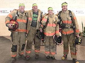 Four Stewartville firefighters took part in the annual Fight for Air Climb at the U.S. Bank Plaza in Minneapolis on Saturday, Feb. 24. The firefighters include, from left, Jeff Olson, Nate Petrich, Lisa Jelinek and Dan Swanson.