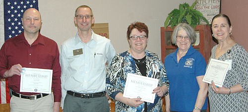 Randy Schmidt, lt. governor of Division 7 of the Kiwanis Club, second from left, inducted the Stewartville School District as a corporate member of the Stewartville Kiwanis Club last week. Representing the school district are, from left, Todd Emanuel, School Board chair; Belinda Selfors, superintendent; and Ellen Rollie, school nurse, far right.  Mary Brouillard, president of the Stewartville Kiwanis Club, is second from right.