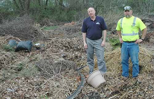 Bill Schimmel Jr., city administrator, left, and Sean Hale, public works director, found a lot of garbage and debris during a recent visit to the city of Stewartville's brush dump, a facility designed only for brush, limbs, tree branches and the like.