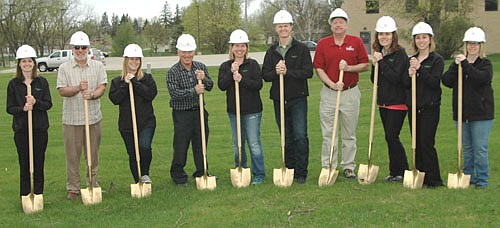 Root River Dental hosted a groundbreaking for its new dental office along Main Street on Thursday afternoon, May 10. Dr. Zachary Lechner and his wife Hannah, center, hosted the groundbreaking at the construction site just south of First American Insurance Services. From left are Natalie Schlagenhaft of the Root River Dental staff, Chris Stafford of the city of Stewartville's Economic Development Authority, Brianna Elwood, Root River Dental staff member; Mayor Jimmie-John King, Hannah Lechner, Dr. Zachary Lechner, Bill Schimmel Jr., city administrator; along with Katy Wiersma, Kayla Gibson and Cindy Tangen, all of the Root River Dental staff.