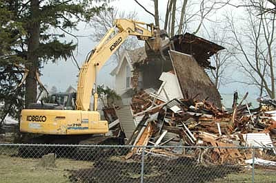 Tory Keefe operated the machine that demolished the Violet Olson home along Main Street in Stewartville on Wednesday, May 2. Keefe, the owner of the property on which the house was built, said he's willing to listen to people who have ideas for a Main Street business at the site.