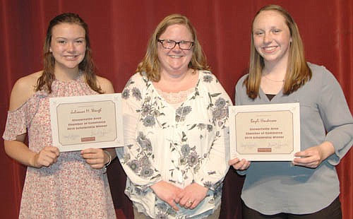 Gwen Ravenhorst, administrator for the Stewartville Area Chamber of Commerce, center, announced SHS seniors Julianne Waugh, left, and Bayli Henderson, right, as the recipients of Chamber scholarships for 2017-18 at the Chamber's Senior Appreciation Banquet last week.  Each graduate will receive $500.