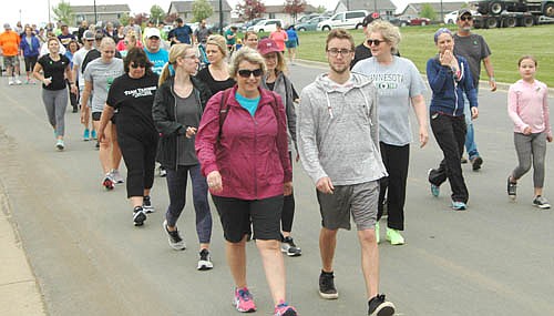 About 160 registered runners and walkers took part in the third annual Samuel L. Becker Memorial 5K on Saturday morning, May 19. Proceeds went to the National Alliance on Mental Illness and to student scholarships.