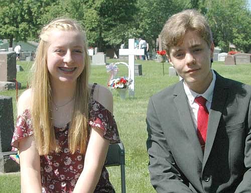 Lydia Fryer, left, and Aleksander Kosmala, eighth graders at Stewartville Middle School, read their patriotic essays to a large Memorial Day audience.