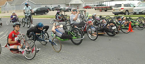 Ironwood Springs Christian Ranch hosted its annual National Wheelchair Sports Camp last week. Some of the camp participants took part in the annual Wheels and Heels of Fire ride from Pizza Ranch in Stewartville to Ironwood Springs on Saturday morning, June 9. Above, the campers get ready to start their six-mile ride.