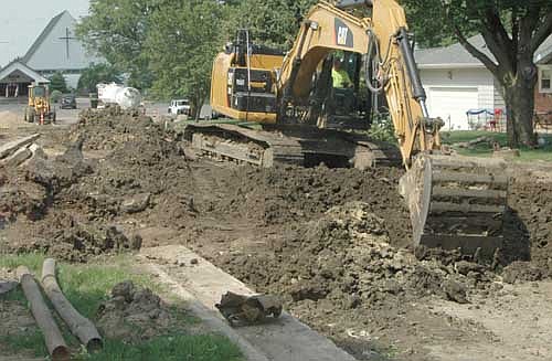 Workers from Edge Contracting moved earth along Fifth Avenue Northeast in Stewartville last week. The Elgin company will fix a number of other streets this summer, including Twelfth Avenue Northeast from Hwy. 30 just beyond the Fifth Street intersection, Sunrise Court, Luella Place Northeast and stubs of Third Street Northeast and Fifth Street Northeast. Last February, the company submitted the low bid for the project, offering to do the construction portion of the work for $1,501,490.35.