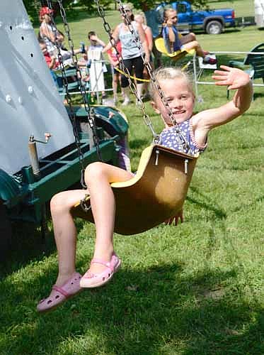 Hazel Kalstabakken enjoyed the swing ride at the Stewartville Area Chamber of Commerce's annual Summerfest celebration on a hot and humid Fourth of July Wednesday afternoon.