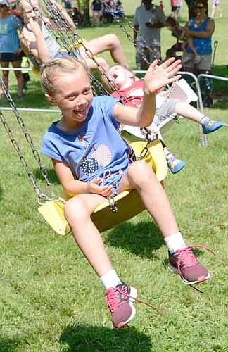 Sophie Kalstabakkenenjoyed the swing ride at the Stewartville Area Chamber of Commerce's annual Summerfest celebration on a hot and humid Fourth of July Wednesday afternoon.