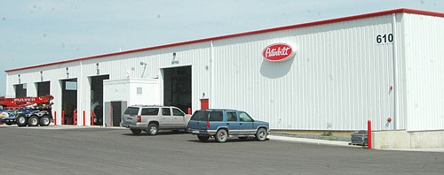 The Peterbilt Truck Center, above, recently established in Stewartville's Schumann Business Park, is open 24 hours a day, employs 20 to 25 workers and could expand to hire up to 50 people. Peterbilt sells, repairs, services and displays trucks.