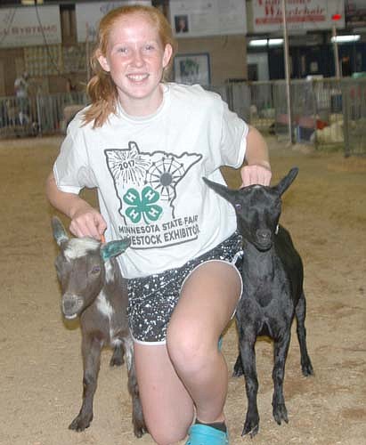 Mesa Wibben, 14, who will be a freshman at Stewartville High School, showed her goats, Bobby Joe and Bella, dry yearling doe Nigerian dwarves, at this year's Olmsted County Fair. The young goats, slightly more than a year old, were born on April 30, 2017.