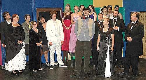 Doolittle (Dave Stepan, center), is having second thoughts about getting married during a dress rehearsal for Stewartville Community Theatre's upcoming presentation of My Fair Lady. Eliza (Katie Eberhard, on his left) and Freddy (Randy Peterson, next to her) are puzzled by his reluctance.