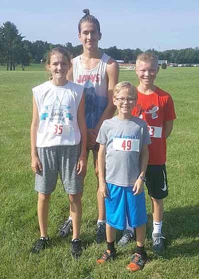 Winners of the fun runs at the BBQ Music Fest at Bear Cave Park include, front row, from left, Avery Spencer and Charlie Boerger, one mile; and back row, from left, 5K winners Jakob Ratelle and Chase Neubauer.
