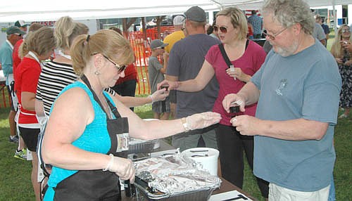 Stewartville and area residents taste-tested samples from seven BBQ chefs at the second annual People's Choice Pulled Pork competition at the BBQ Music Fest at Bear Cave Park on Saturday, July 28. Leon Lipkie of Stewartville, owner of Lenny's BBQ, was the winner of the pulled pork contest.