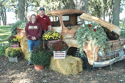 Joe and Jill Haggerty, who live along Highway 30 about three miles east of Stewartville, pose near their 1950 International pickup truck, decorated with mums, geraniums, ivy and more. Jill came up with idea to decorate the truck three years ago. "Every year I keep adding more to it," she said. "I love Pinterest. You look on Pinterest to come up with the ideas." People who pass the Haggerty property often stop by to get their pictures taken with the truck, Jill said. "It used to be that we were the ones who lived about three miles east of Stewartville," she said. "Now it's, 'You're the place with the really cool truck.' "