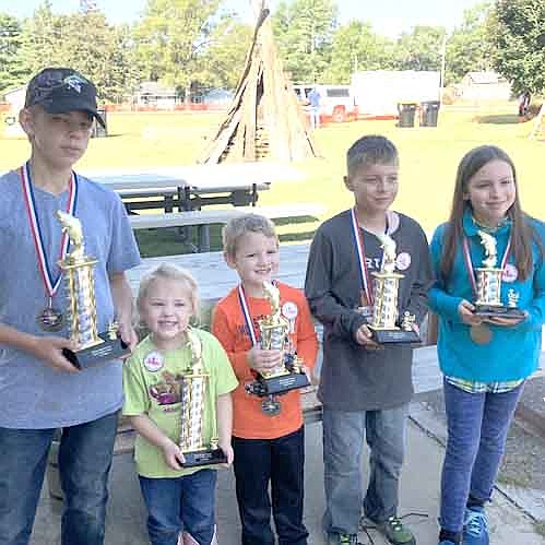 Winners in the Old Settlers Day fishing contest included, from left, Nathanael Biffert, first place, game fish; Izzy Slovinski Zipperer, first place, rough fish; Walker Lawrence, second place, rough fish; Kenny Hutchinson, second place, game fish; and Eva Biffert, third place, rough fish. 