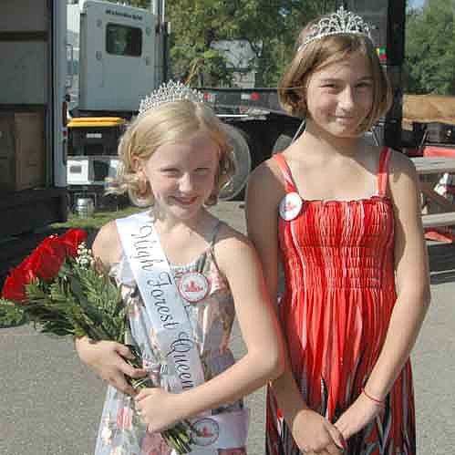 Hannah Meyerhofer, 8, a third grader at Bear Cave Intermediate School, left, was crowned queen of the 2018 Old Settlers Day. Madison Meyerhofer, Hannah's older sister and last year's Old Settlers Day queen, right, placed the crown on Hannah's head.