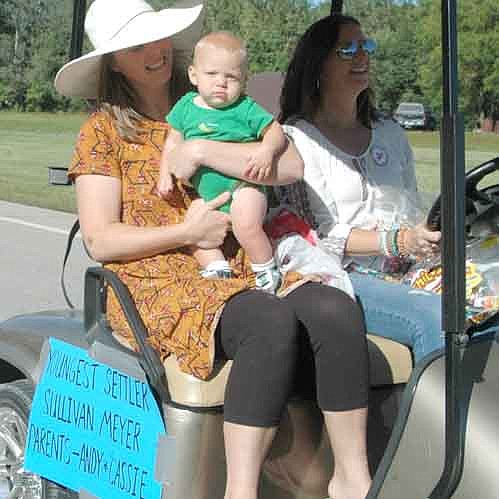 Sullivan Meyer, son of Andy and Cassie Meyer, is the youngest settler featured in this year's 95th annual Old Settlers Day Parade. The 2018 Old Settlers Day celebration also included a kids pedal tractor pull, a kickball game, horse-drawn wagon rides and more.