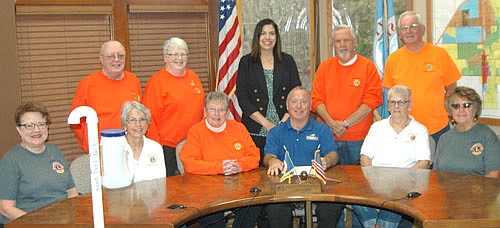 Mayor Jimmie-John King, seated third from right, signed a proclamation last week declaring this Saturday, Oct. 6 "White Cane Day" in the city of Stewartville. On that day, members of the Stewartville Morning Lions Club will accept donations at the two Kwik Trips, the two Casey's stores and Fareway to fight blindness and other eye diseases. Some of the Morning Lions members who will participate in the project include, front row, from left, Janet Speltz, Sheila Majerus, Kay Tvedt, chair of White Cane Day; Mayor King, Karen Freiheit and Sharon Moehnke. Back row, from left, Lucien Cole, Carol Cole, Margaret Nelson, David Hoot and Clair Mrotek.