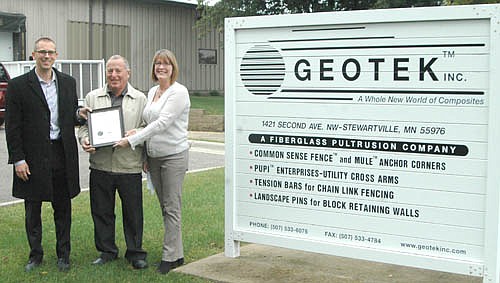 Natalie Siderius, southeast region business development manager for the Minnesota Department of Employment and Economic Development (DEED), right, presents a proclamation signed by Gov. Dayton to Ben Wiltsie, president and chief executive officer of GEOTEK of Stewartville, left, and to Stewartville Mayor Jimmie-John King. GEOTEK hosted tours of its company for Minnesota Manufacturing Week last week.
