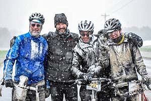 From left, John Powell, Trenton Raygor, race director; Luke Breen and Derek Carlson, all of Minneapolis, enjoyed the Filthy 50's cold and snow.