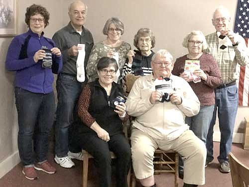 Members of the Stewartville Kiwanis Club encourage local and area residents to donate to the club's second annual sock drive. Members include, front row, from left, Glynis Sturm and Ed Rowley. Back row, from left, Carol Youdas, Don Brouillard, Mary Brouillard, Margaret Clark, Janice Hagen and Lincoln Harker.