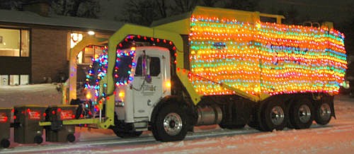 Sunshine Sanitation's entry in the Winterfest Standstill Parade was a lighted sleigh truck that included a team of garbage can reindeer.