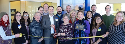 The Stewartville Area Chamber of Commerce welcomed Think Bank-Shoppes on Maine location to the Chamber with a ribbon-cutting    ceremony on Wednesday, Jan. 9. Branch Manager Jeff Sabatke (middle, with scissors) and Business Development Representative Judy Braatz (middle, holding Chamber plaque) led the celebration with Think Bank employees and Chamber members. Those attending included, from left, Allie Fryer of Smidt Companies/ Racine Storage, Anna Brouwer of Think Bank, Shanalyn Bird of Think Bank, city of Stewartville Mayor Jimmie-John King, Ross Zumbach of Think Bank, Brad Schroeder of Think Bank, Sabatke, Travis Hodny of Think Bank, Myrna Welter, Chamber membership coordinator, Chris Barnick, senior vice president of consumer banking at Think Bank, Karen Golberg of Think Bank, Braatz, Kate Staffon of Think Bank, Joel McNeil of Think Bank, Zaida Garcia of Think Bank, Dillon Welter of Welter Entertainment DJ Services, and Gwen Ravenhorst, Chamber administrator.