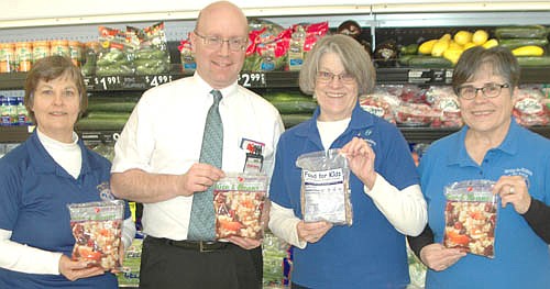 Robert Hruska, grocery manager of Fareway, second from left, invites the store's shoppers to donate to the 16th annual Food for Kidz effort at Fareway now through Saturday, Feb. 2. Stewartville Kiwanis Club Food for Kidz helpers include, from left, Rita Oswald, Mary Brouillard, co-chair of the event; and Glynis Sturm. Traditionally, Food for Kidz sends meals to starving children in many poor countries around the world.